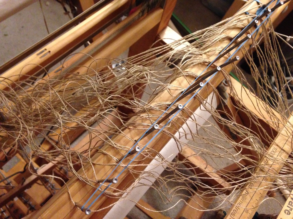 Warping the loom with linen thread